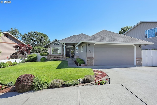 1907 Quinton St, The Dalles, OR 97058 - view of front facade with brick siding, a garage, driveway, and a shingled roof