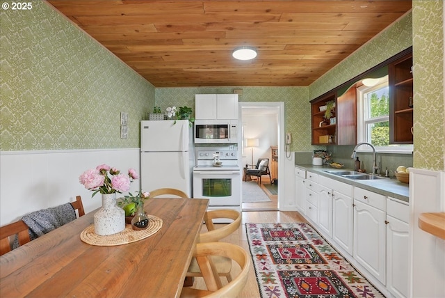3615 NE 72nd Ave, Portland, OR 97213 - kitchen featuring white appliances, wallpapered walls, open shelves, wainscoting, and wooden ceiling