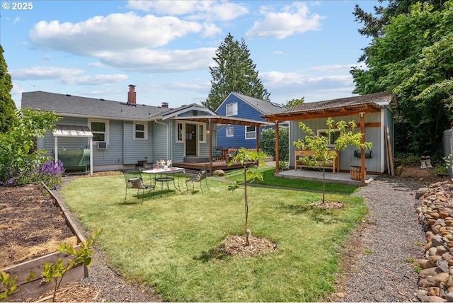 3615 NE 72nd Ave, Portland, OR 97213 - back of house featuring a deck, a yard, a chimney, an outbuilding, and board and batten siding