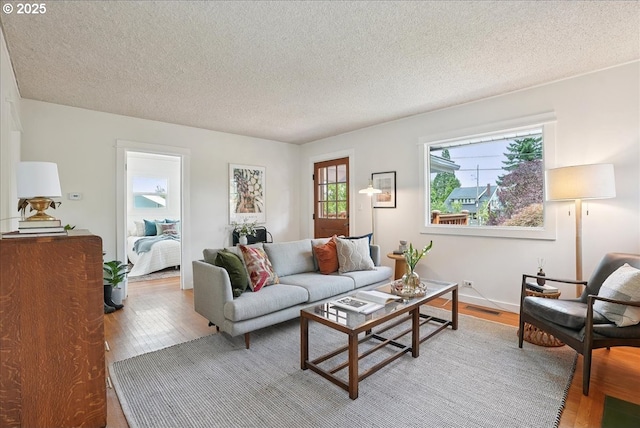 3615 NE 72nd Ave, Portland, OR 97213 - living room with light wood-type flooring and a textured ceiling