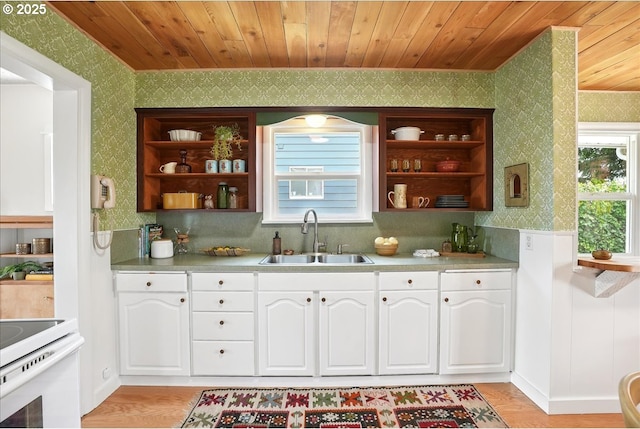 3615 NE 72nd Ave, Portland, OR 97213 - kitchen featuring wallpapered walls, open shelves, wooden ceiling, white cabinetry, and light wood finished floors