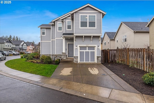 view of front of house with a garage and a front lawn