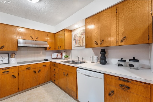 kitchen featuring dishwasher, under cabinet range hood, a sink, black electric stovetop, and brown cabinets