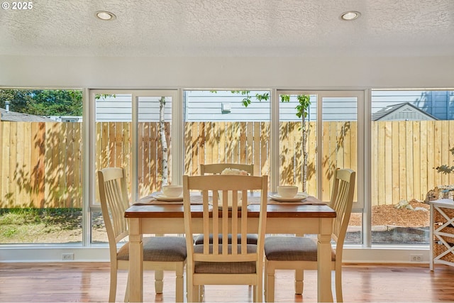 1952 SE 139th Ave, Portland, OR 97233 - dining space featuring a textured ceiling, wood finished floors, plenty of natural light, and recessed lighting