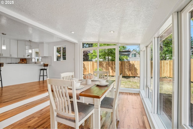 1952 SE 139th Ave, Portland, OR 97233 - sunroom featuring a textured ceiling, wood finished floors, and recessed lighting