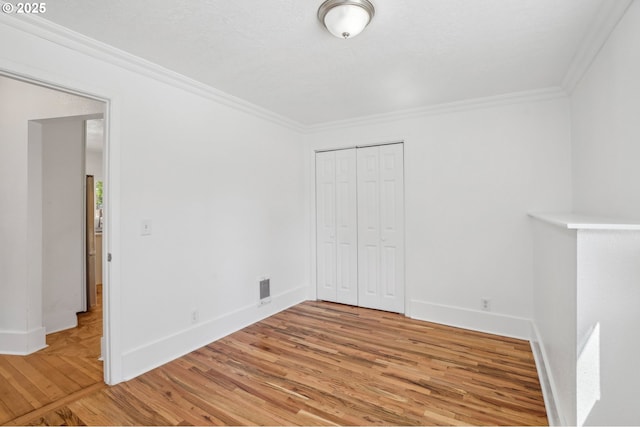 1952 SE 139th Ave, Portland, OR 97233 - unfurnished bedroom with crown molding, light wood-type flooring, baseboards, and a closet