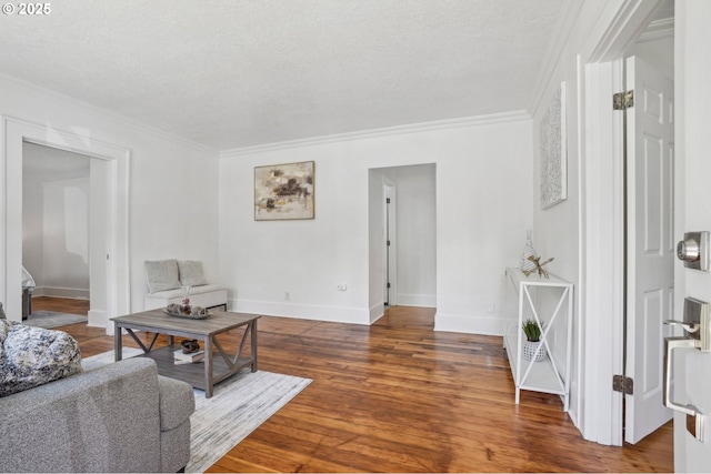 1952 SE 139th Ave, Portland, OR 97233 - living area featuring crown molding, wood finished floors, baseboards, and a textured ceiling
