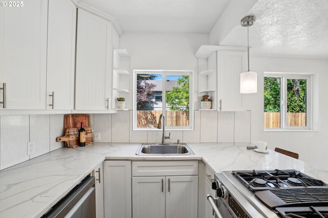 1952 SE 139th Ave, Portland, OR 97233 - kitchen with open shelves, a sink, appliances with stainless steel finishes, and white cabinetry