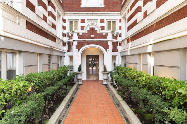 entrance to property with brick siding