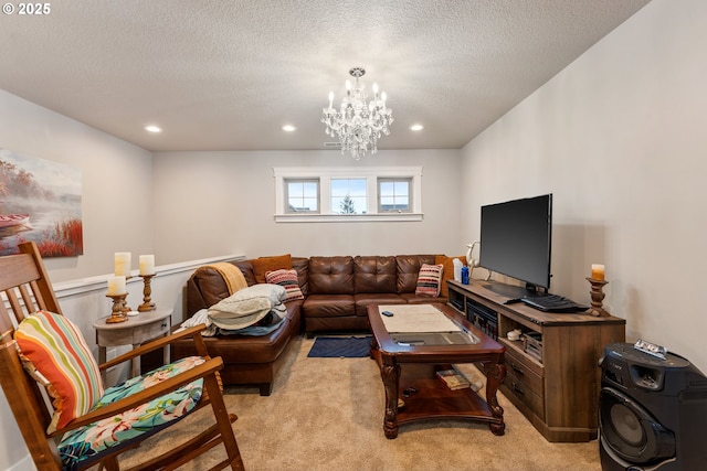 carpeted living room with a notable chandelier and a textured ceiling