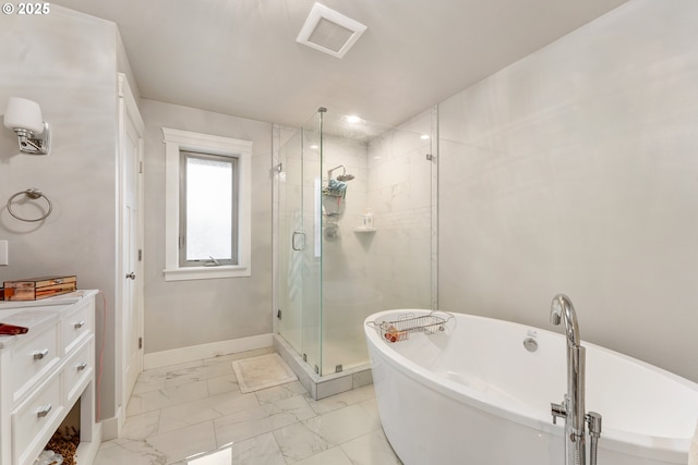 bathroom with vanity and shower with separate bathtub