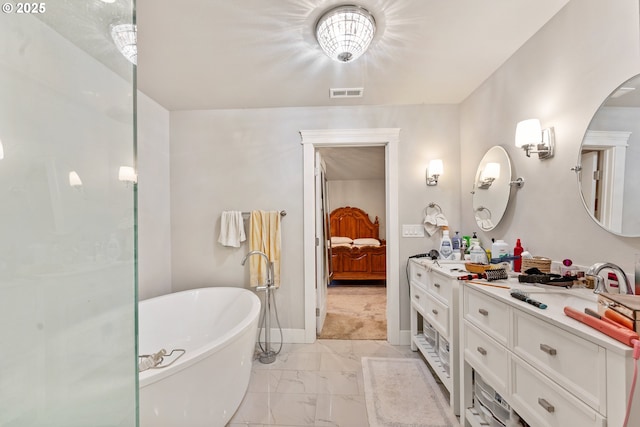 bathroom with vanity and a bathtub