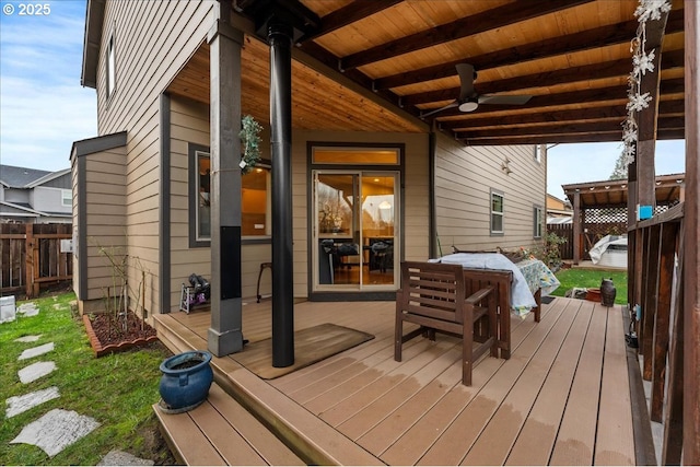 wooden deck featuring ceiling fan