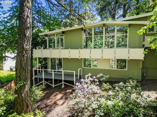 3220 NW Crest Dr, Corvallis, OR 97330 - view of side of property with a wooden deck and a chimney