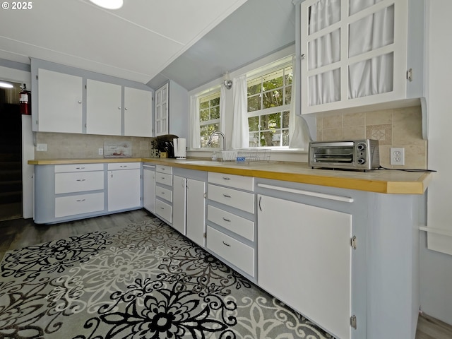 97994 W Benham Ln, Brookings, OR 97415 - kitchen featuring white cabinetry, butcher block counters, backsplash, a sink, and lofted ceiling
