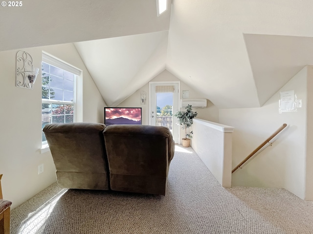 97994 W Benham Ln, Brookings, OR 97415 - living area featuring a wall mounted AC, healthy amount of natural light, carpet, and lofted ceiling