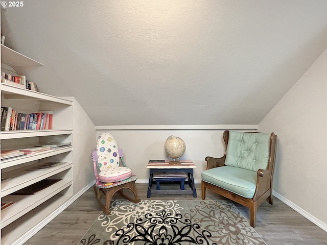 97994 W Benham Ln, Brookings, OR 97415 - living area with wood finished floors, baseboards, and vaulted ceiling