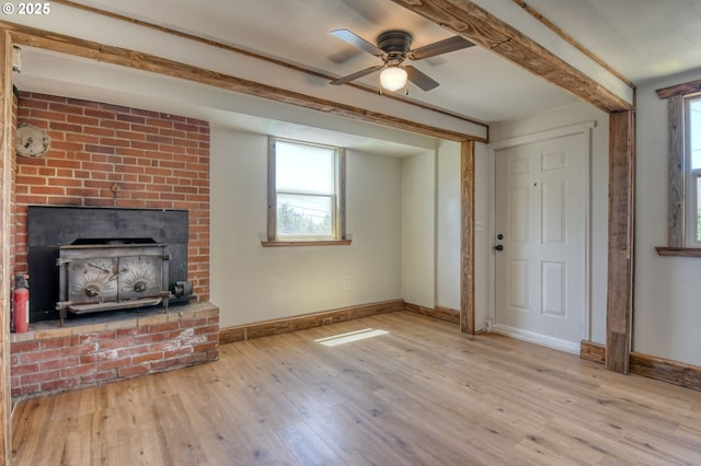 501 NW 6th St, Pendleton, OR 97801 - unfurnished living room with wood finished floors, ceiling fan, and a brick fireplace