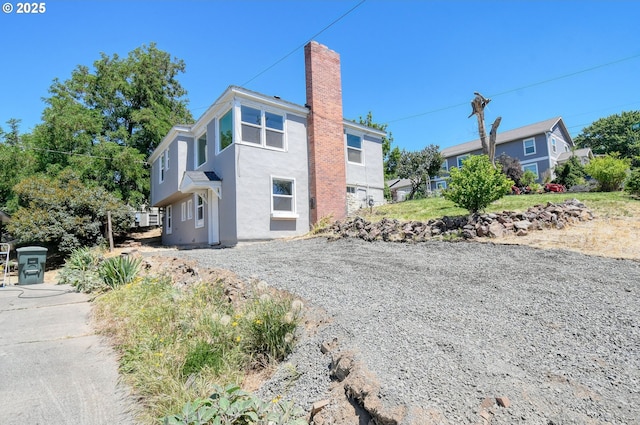 501 NW 6th St, Pendleton, OR 97801 - view of front of property featuring a chimney and stucco siding