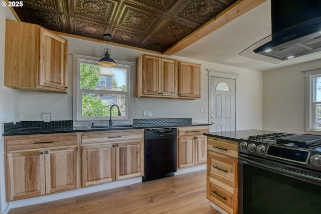 501 NW 6th St, Pendleton, OR 97801 - kitchen featuring dishwasher, range with gas stovetop, light brown cabinetry, exhaust hood, and plenty of natural light