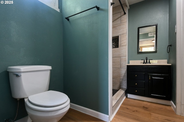 501 NW 6th St, Pendleton, OR 97801 - bathroom with a stall shower, wood finished floors, and vanity