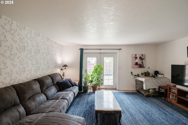 living area with french doors, wallpapered walls, and a textured ceiling