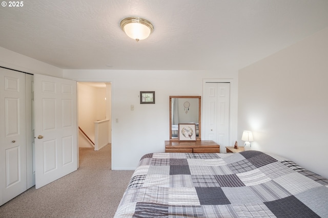 carpeted bedroom with a closet