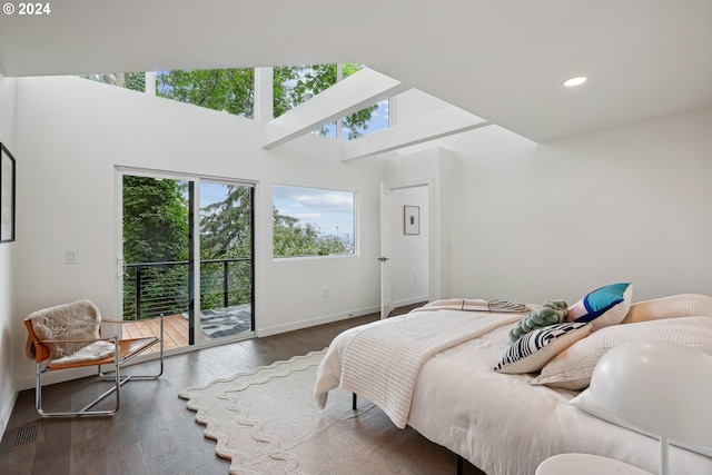 bedroom featuring access to outside and dark hardwood / wood-style floors