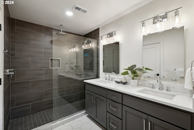 bathroom featuring vanity, tile patterned flooring, and a shower with door