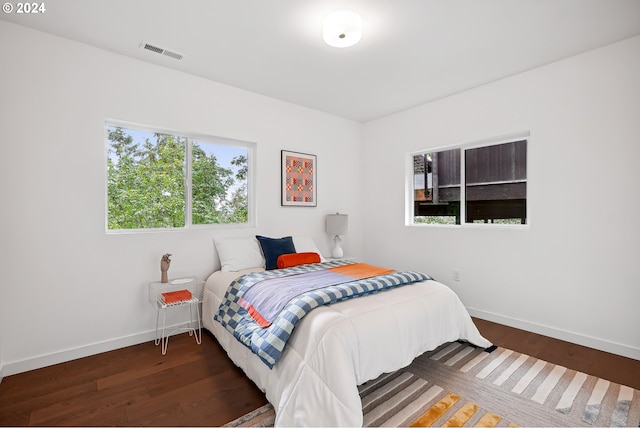 bedroom featuring dark hardwood / wood-style floors