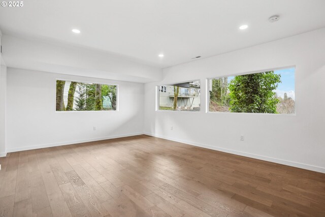 bedroom featuring dark hardwood / wood-style floors and two closets