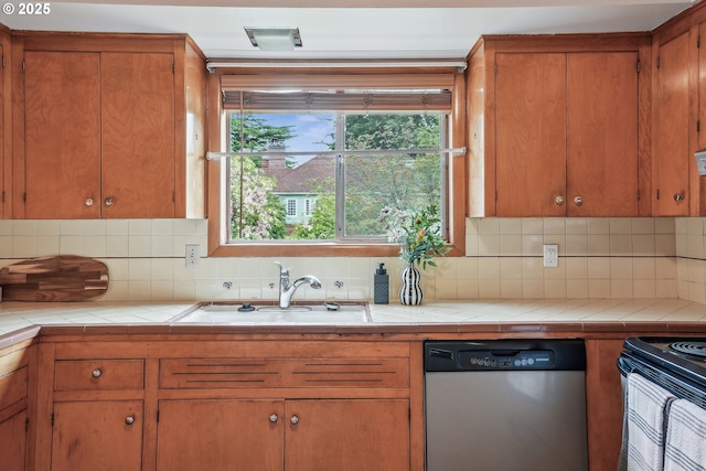 5955 NE 32nd Ave, Portland, OR 97211 - kitchen featuring a sink, tile countertops, dishwasher, backsplash, and electric range oven