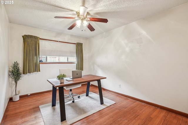 5955 NE 32nd Ave, Portland, OR 97211 - home office featuring a textured ceiling, baseboards, a ceiling fan, and wood-type flooring