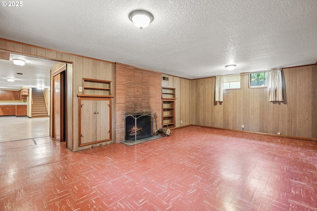 5955 NE 32nd Ave, Portland, OR 97211 - unfurnished living room featuring stairway, wooden walls, and tile patterned floors