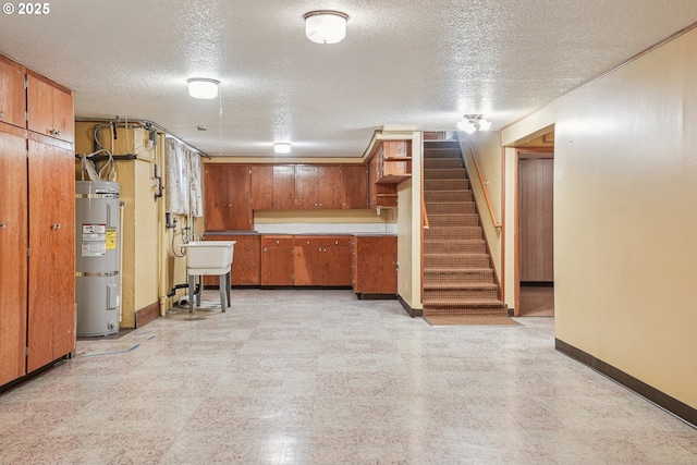 5955 NE 32nd Ave, Portland, OR 97211 - finished below grade area with water heater, light floors, a textured ceiling, baseboards, and stairs
