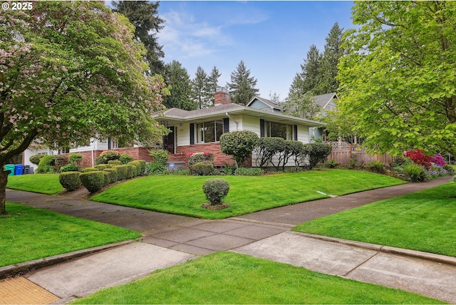 5955 NE 32nd Ave, Portland, OR 97211 - view of front facade with a chimney, brick siding, and a front lawn
