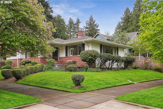 5955 NE 32nd Ave, Portland, OR 97211 - view of front facade with a chimney, a front yard, and fence