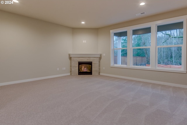 unfurnished living room with carpet floors