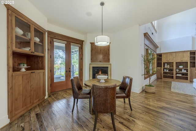2892 Riverwalk Loop, Eugene, OR 97401 - kitchen with appliances with stainless steel finishes, decorative backsplash, custom range hood, and light wood-style flooring