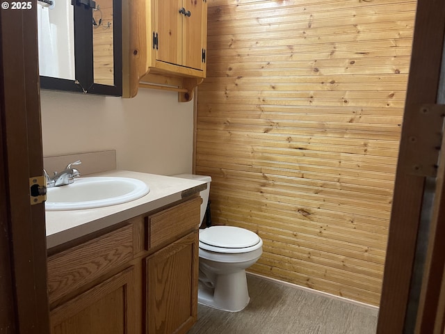 bathroom with vanity, wood-type flooring, and toilet