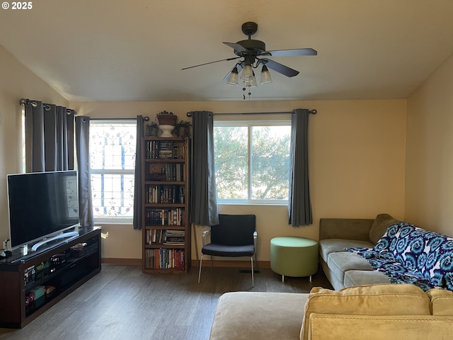 living room with hardwood / wood-style floors and ceiling fan