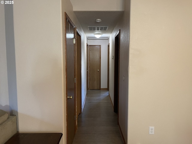 corridor featuring dark wood-type flooring