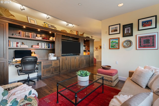 living room featuring visible vents, track lighting, dark wood-type flooring, baseboards, and built in study area