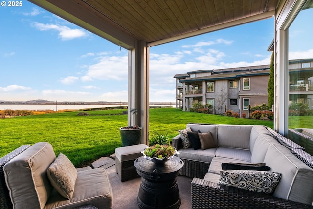 view of patio featuring an outdoor living space and a water view