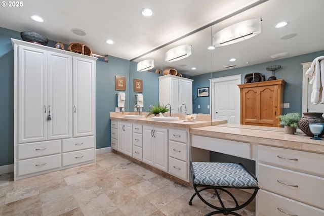 full bath featuring recessed lighting, vanity, and baseboards