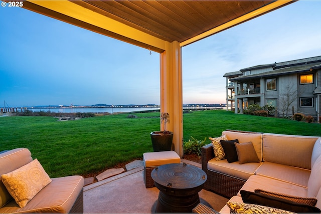 view of patio featuring outdoor lounge area and a water view