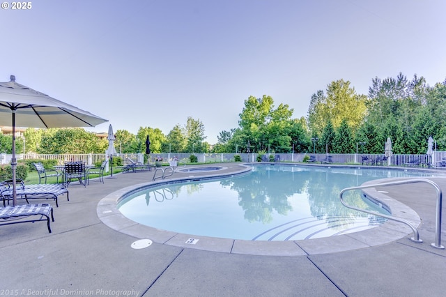 pool featuring a patio area and fence