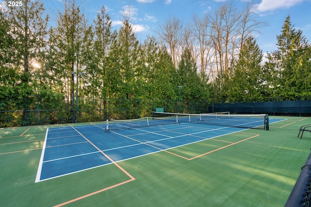 view of tennis court with fence