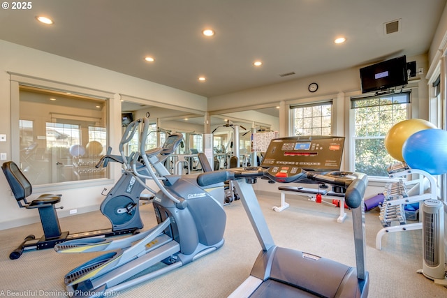 gym featuring recessed lighting, visible vents, and a wealth of natural light