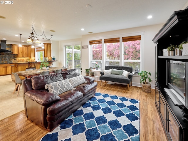 living room featuring light wood finished floors and recessed lighting